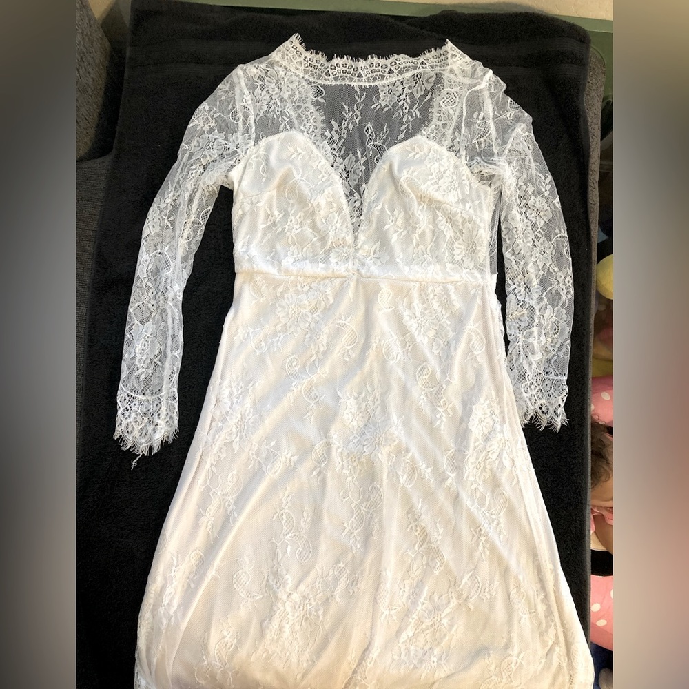 Off white wedding dress. Lace, size large. Never been worn
